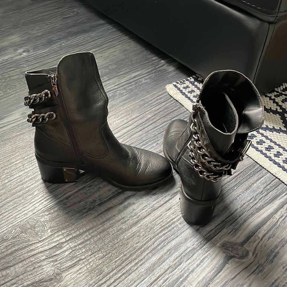 Fergie black leather chain and buckle boots